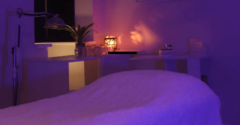 D.r.E Therapy Treatment Room Purple treatment room with massage bed at D.r.E Therapy